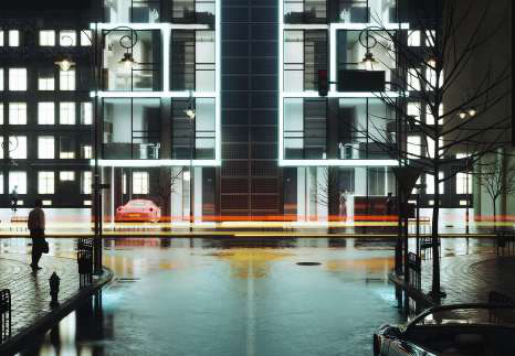 Night street view of the housing tower: glowing white unit frames, wet pavement, a red car, and light trails from traffic.
