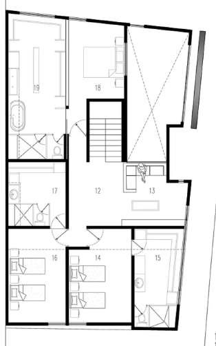 Upper-floor plan: bedrooms and bathrooms around the central stair and a void over the living room.
