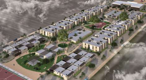 Aerial view of modular two-story housing around landscaped walkways, with greenhouses at the edge of the site.