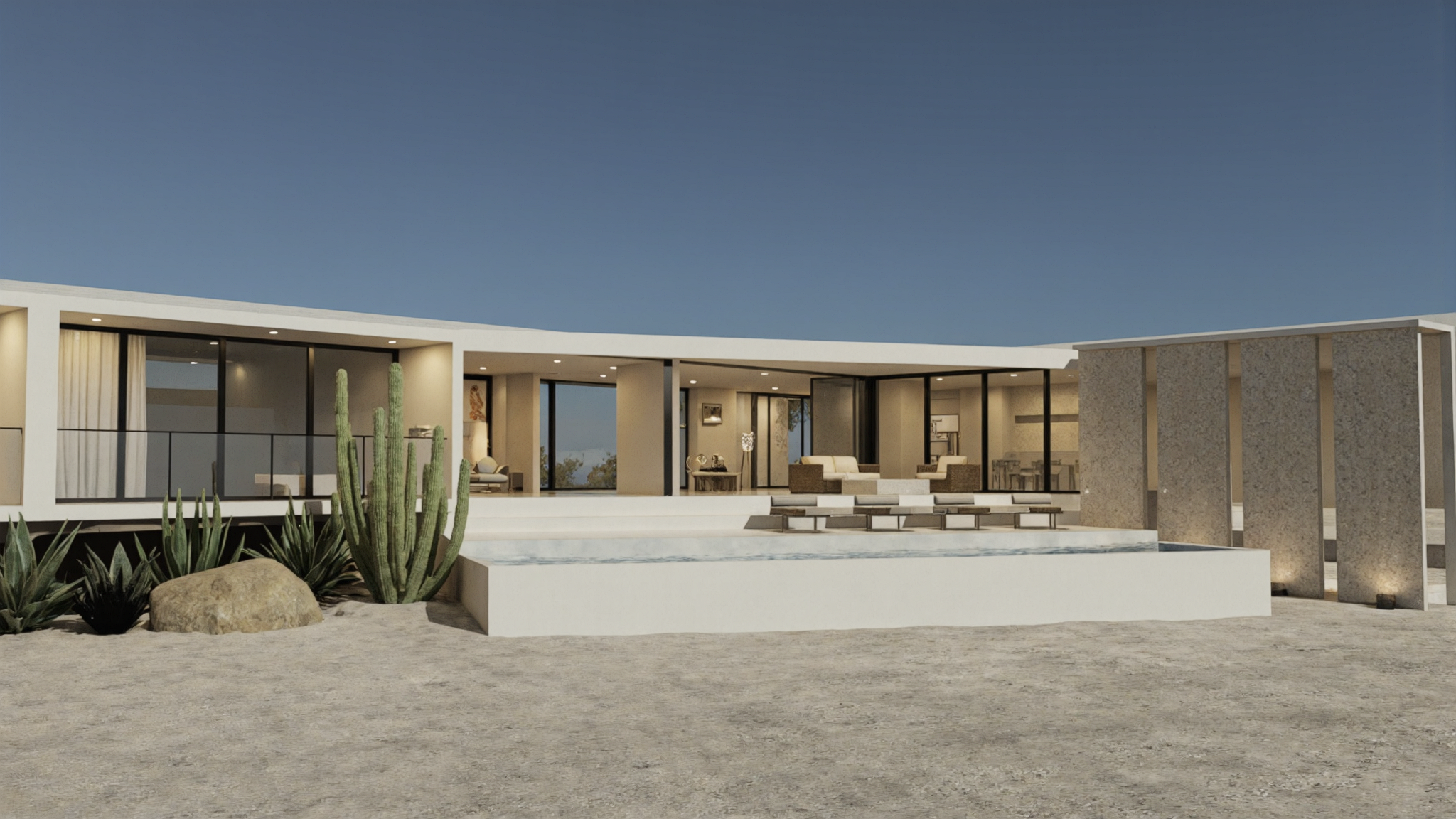 Zorro y Toro at dusk: courtyard infinity pool, four lounge chairs, and a row of vertical stone slabs beside the open living pavilion.