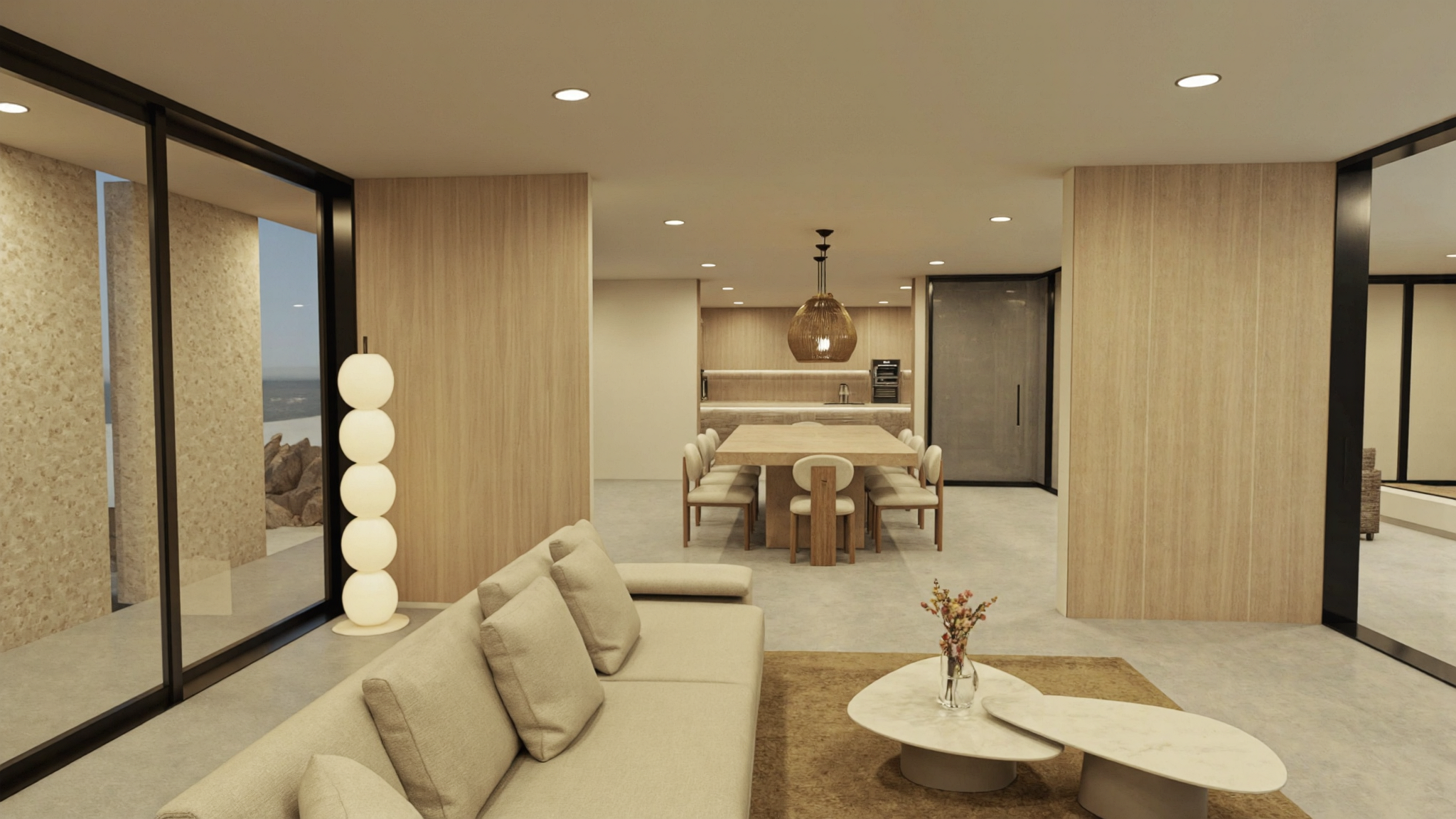 Open-plan living, dining, and kitchen: beige sofa, wood dining table with rounded-back chairs, and light-wood kitchen cabinetry.